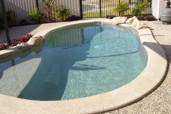 In ground concrete pool filling built by UC Pools in Brisbane